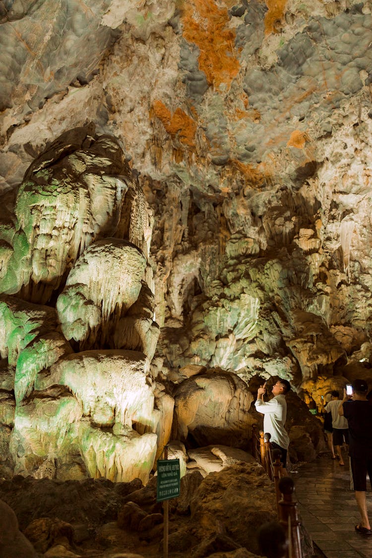 Photo Of People In A Cave