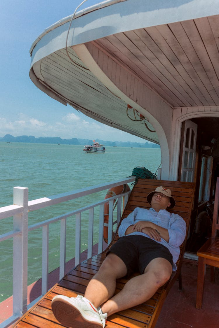 Photo Of A Sleeping Man On A Ship