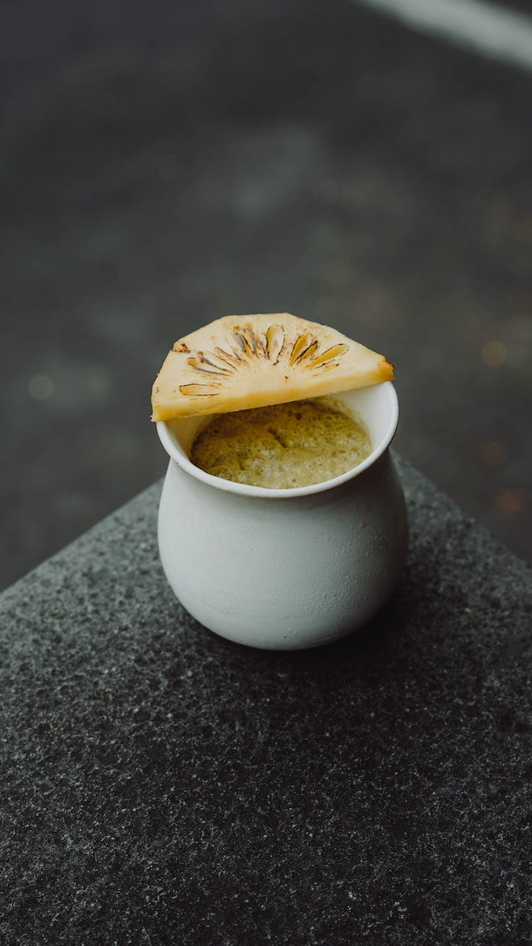 Piece Of Fruit On A White Cup 