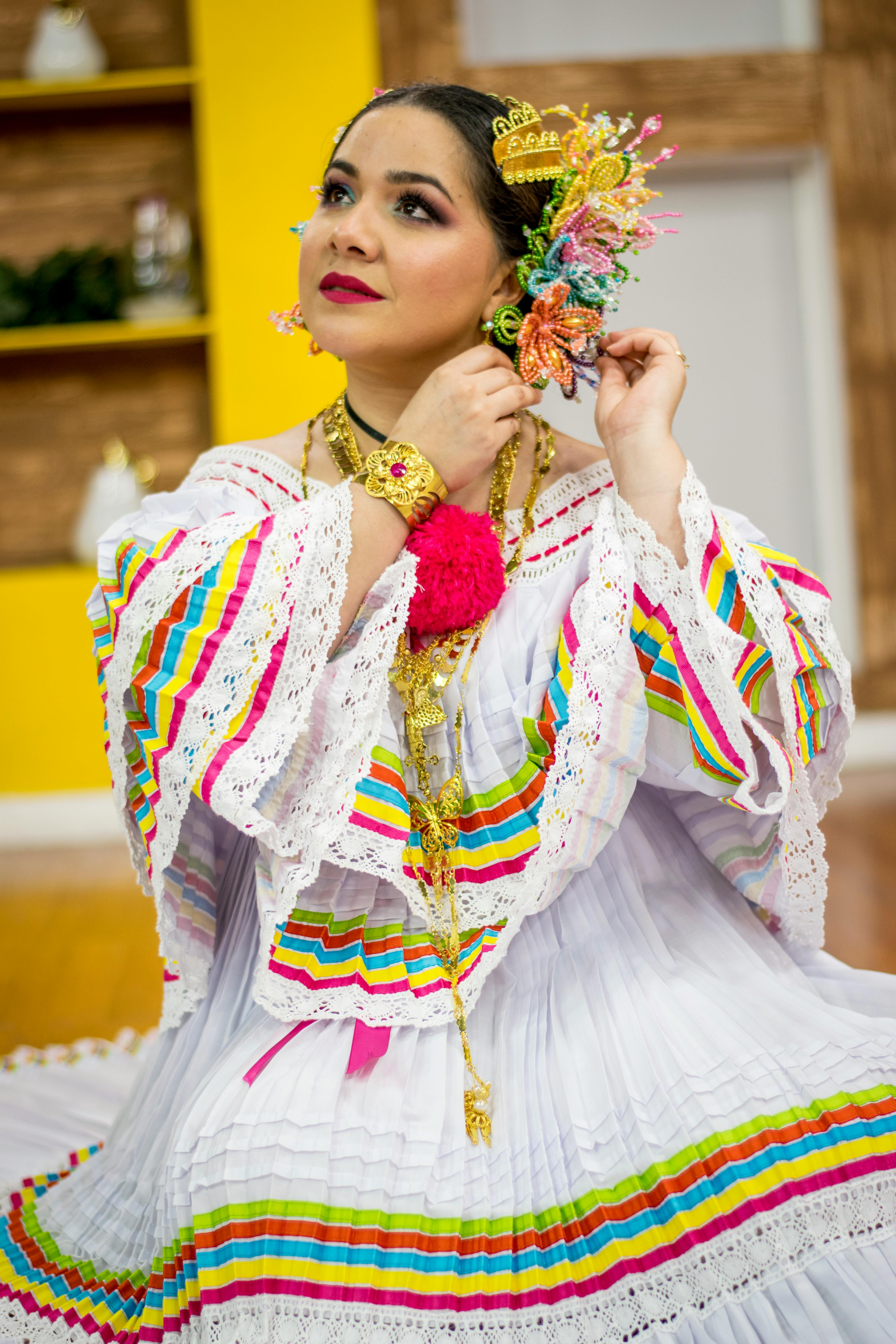 selective focus photography of woman holding floral hairpiece