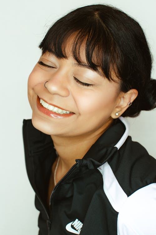 Smiling Woman with Eyes Closed