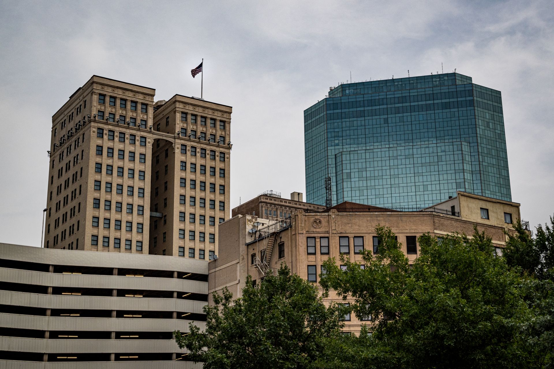 A cityscape showcasing contrasting architectural styles in downtown Fort Worth.