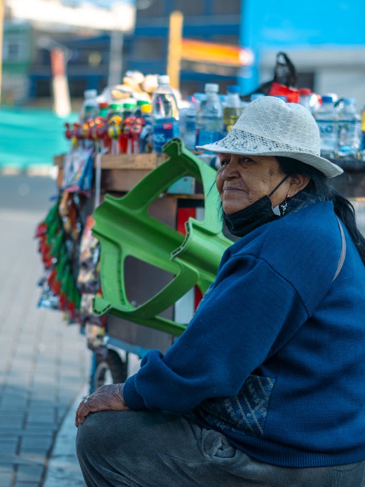 Street Vendor In Hat