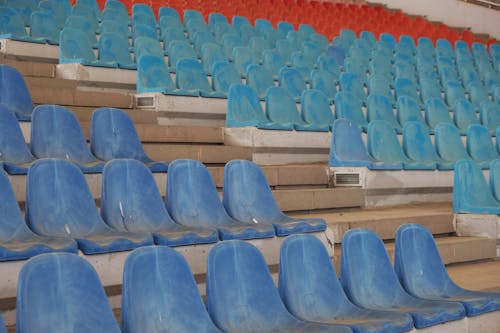 Rows of Empty Plastic Seats at a Stadium 