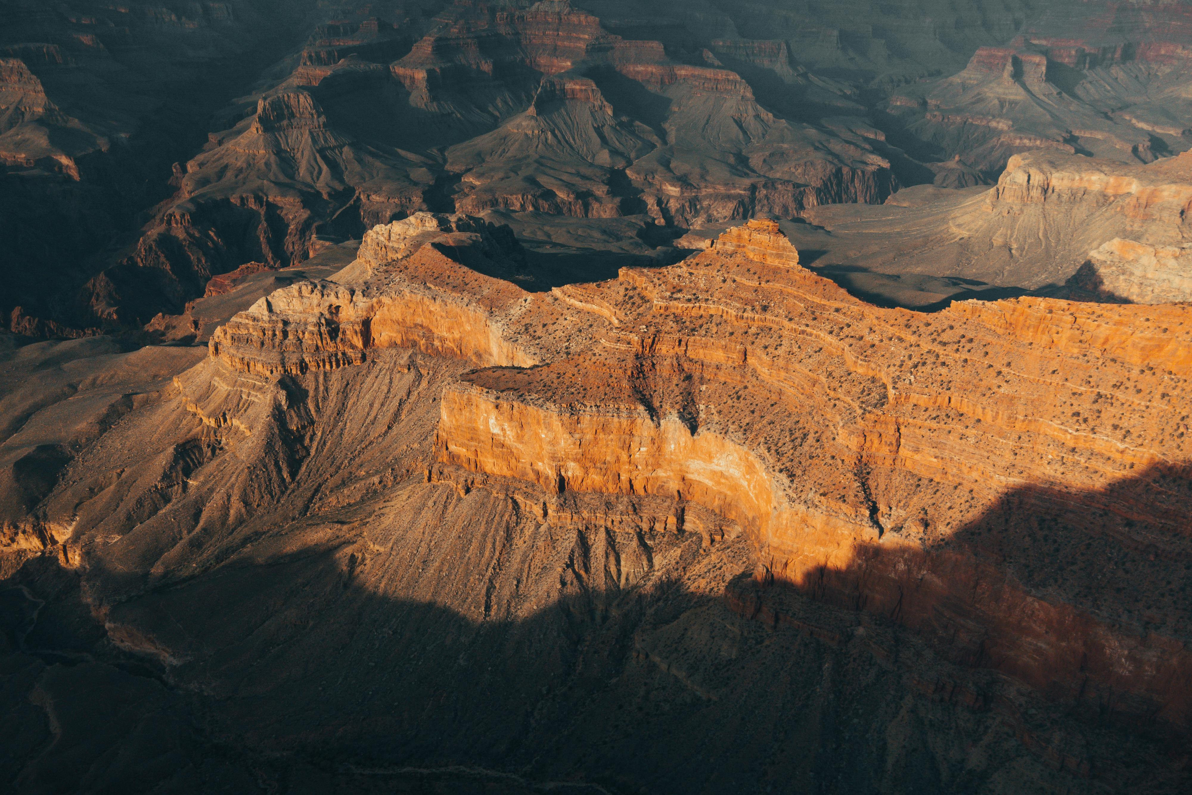 Beautiful aerial shot of Grand Canyon West's rugged landscape showcasing vibrant earth tones.