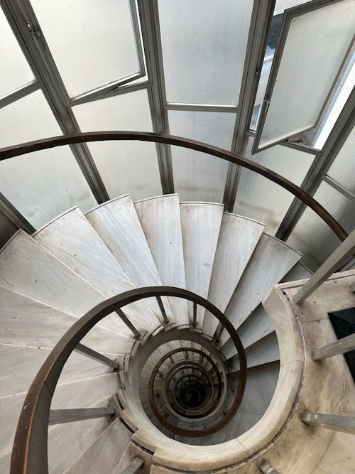 Free High Angle Shot of a Spiral Staircase  Stock Photo