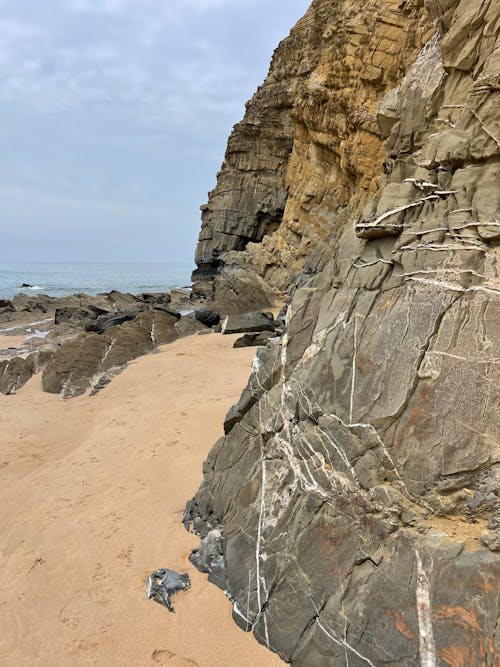 View of a Rocky Cliff on the Shore 