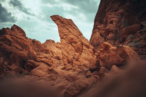 Free Stunning red rock formations under cloudy skies in Moapa Valley, Nevada. Stock Photo