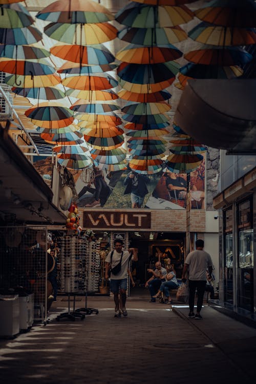 Colorful Umbrellas Hanging above the Street 