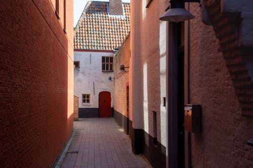Narrow Paved Alley Between Houses