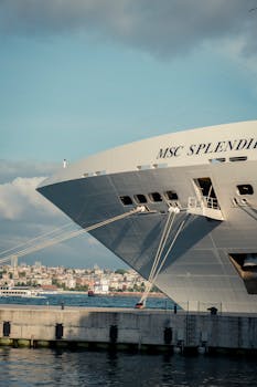 Elegant cruise ship MSC Splendida docked at a bustling harbor, showcasing maritime travel and architecture.