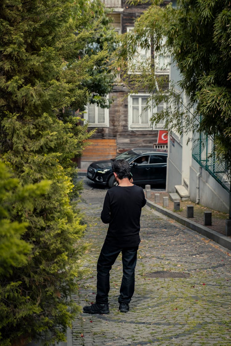 Man Talking On Phone On Street