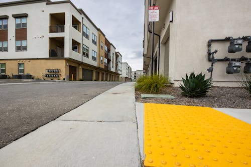 Yellow Bump Indicators on Sidewalk 