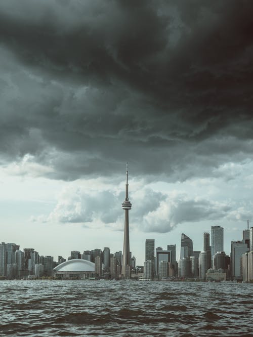 Skyline of Toronto under a Cloudy Sky seen from the Lake 