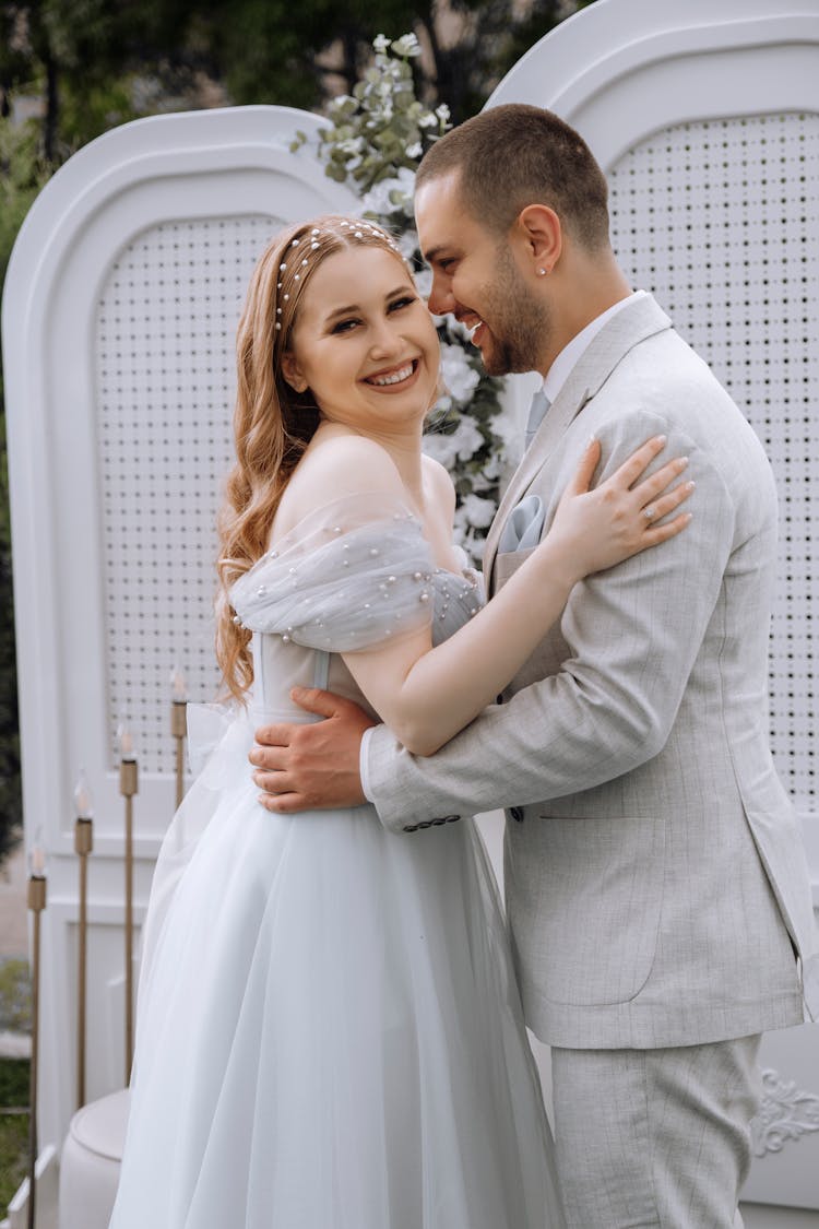 Smiling Newlyweds Hugging