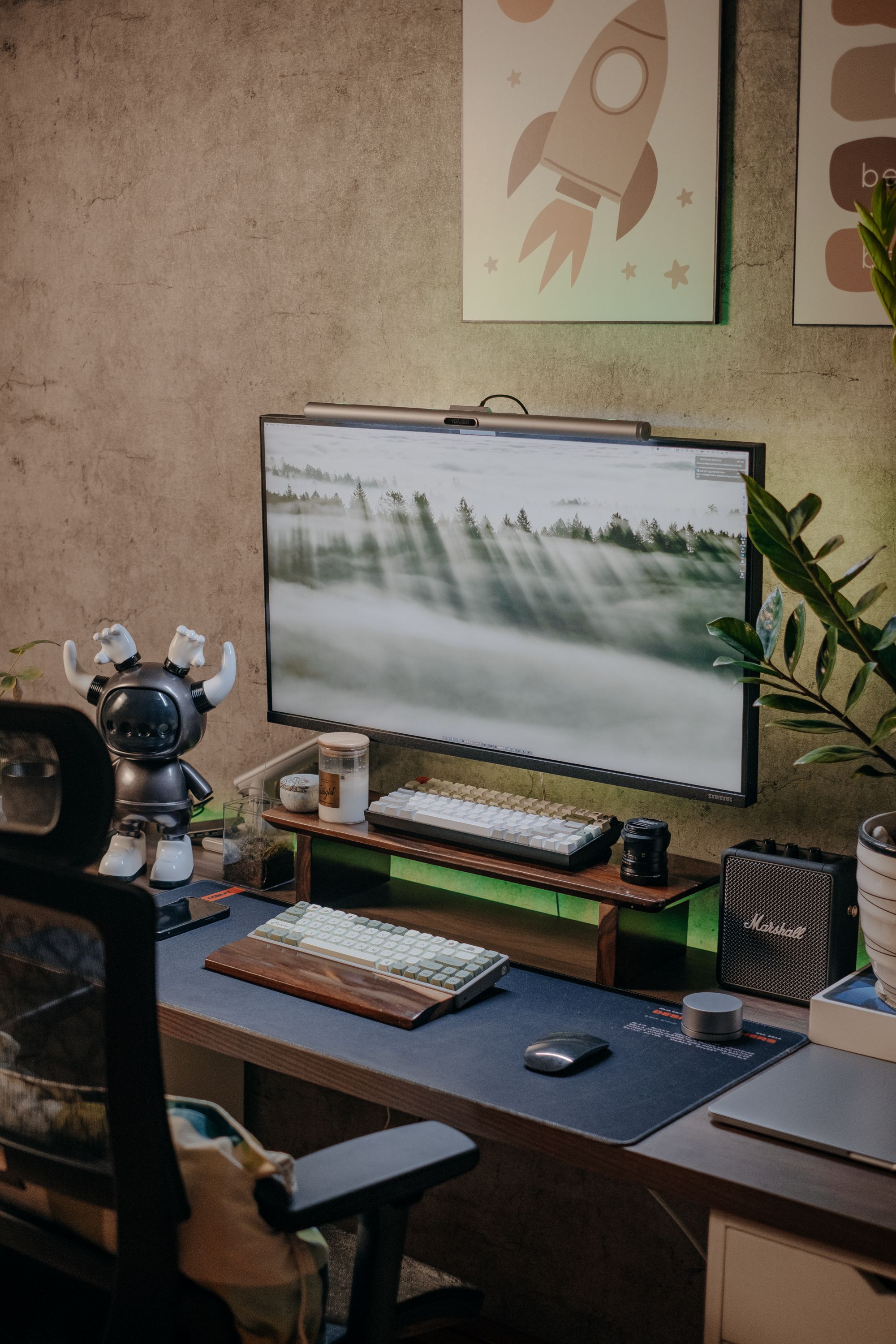 Stylish home office setup with computer, keyboard, and tech gadgets on a desk.. stylish, home, office