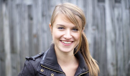 Young Happy Woman in a Leather Jacket 