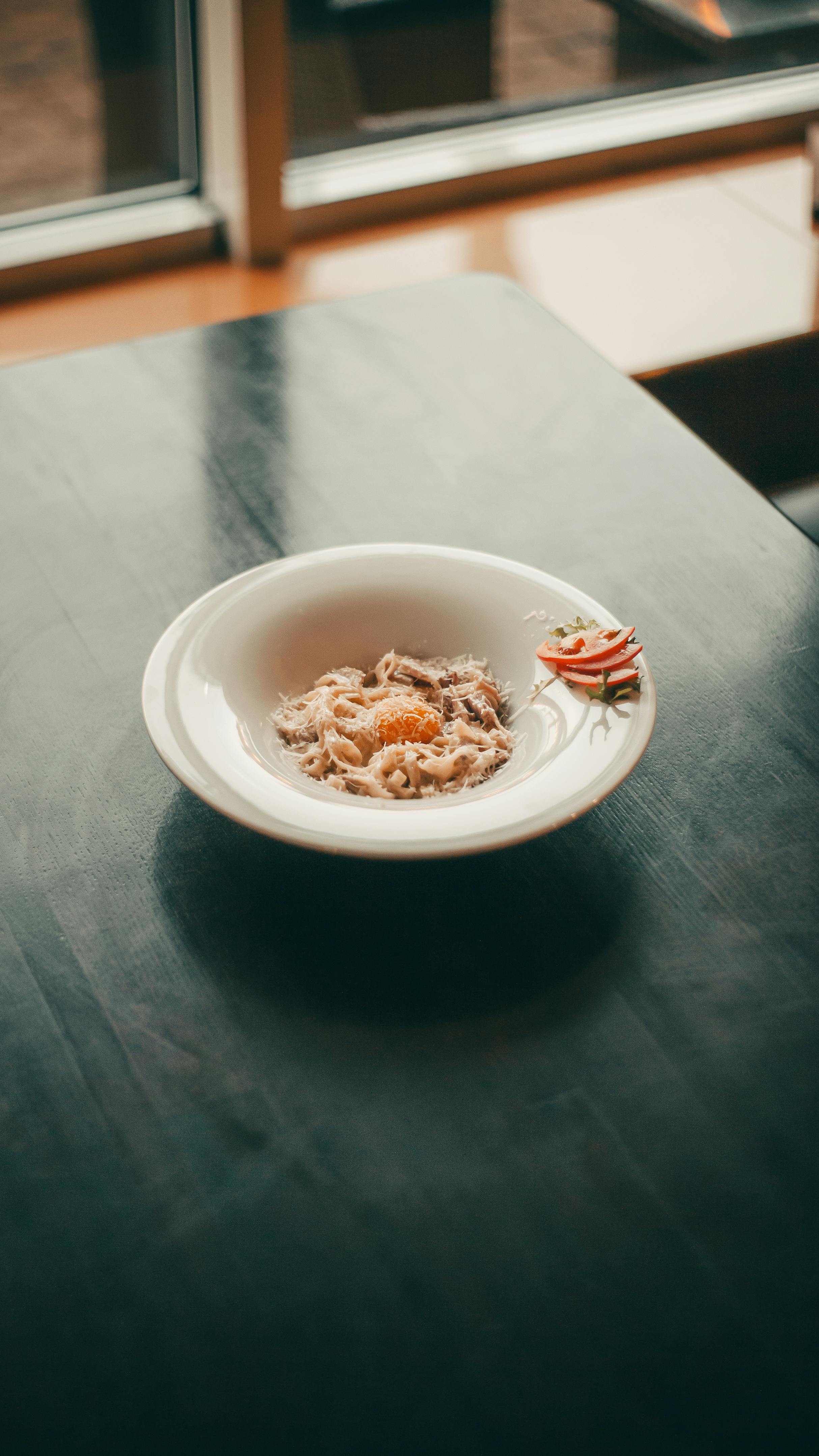 Pasta on White Bowl Besides Fork · Free Stock Photo