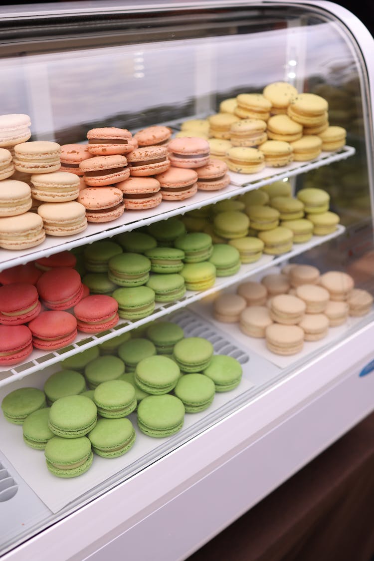 Colorful Macarons On Display In A Bakery 