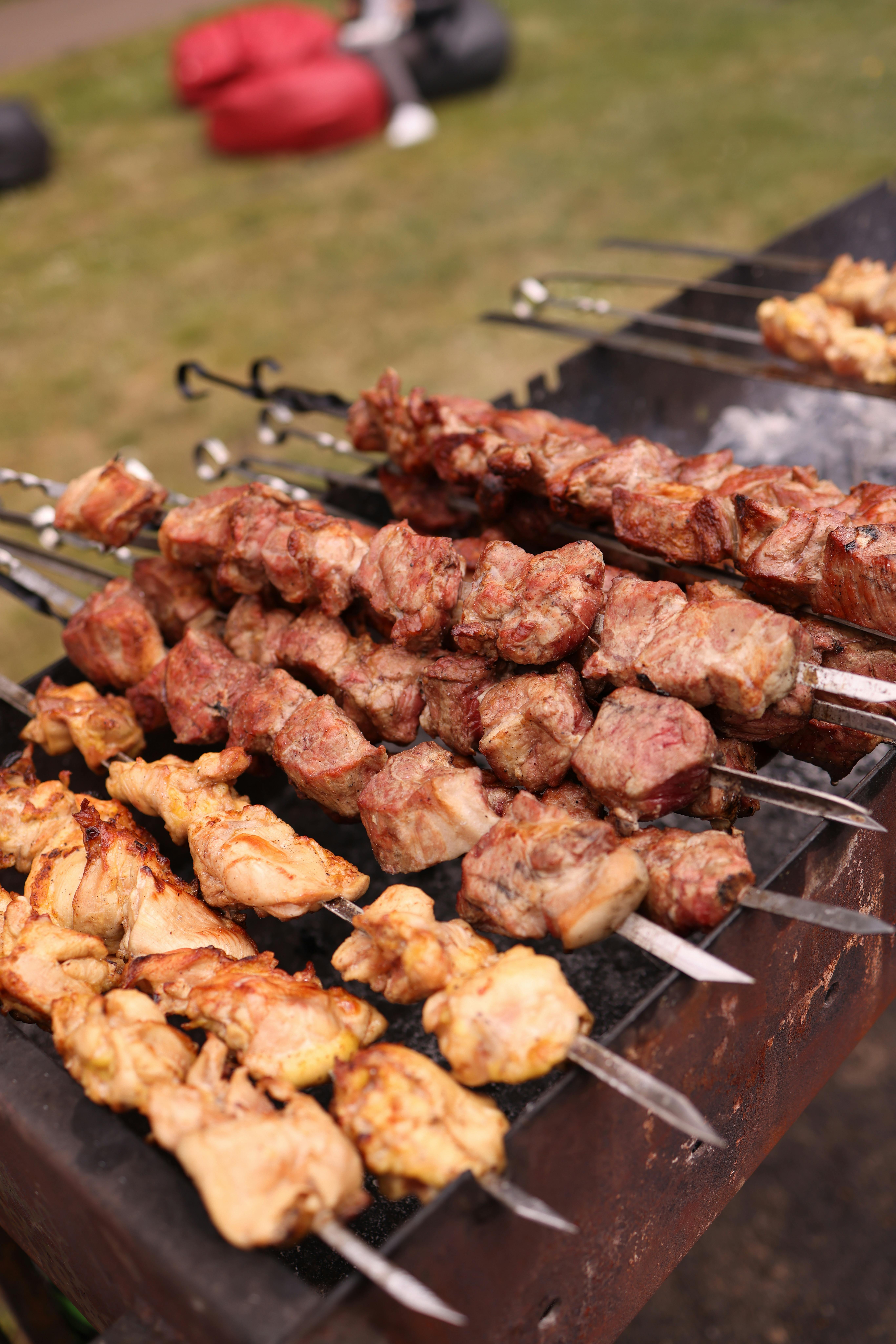 close up of kebabs on the grill