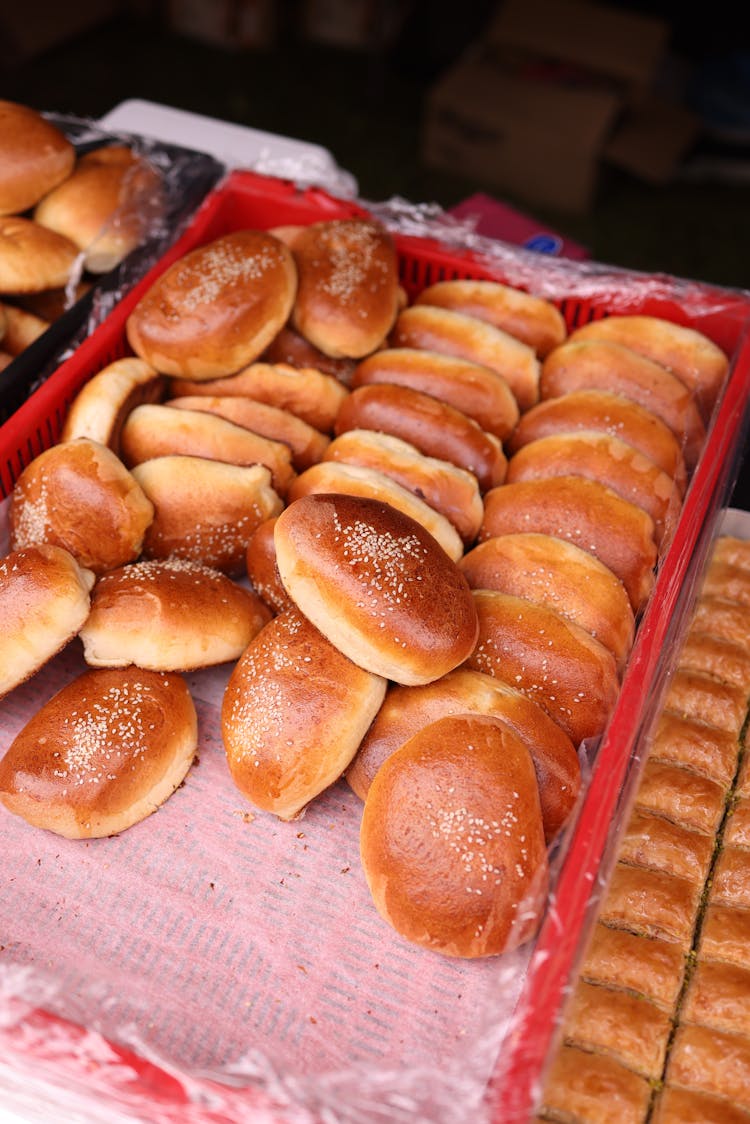 A Variety Of Rolls In Baskets At A Market 