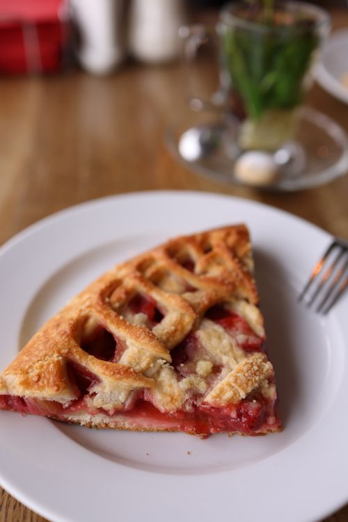 Free Close-up of a delicious strawberry pie slice served on a white plate. Stock Photo