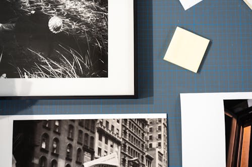 Sticky Notes and Black and White Pictures on Table