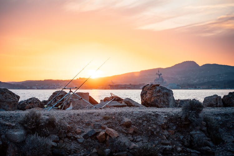 Fishing Rods In Bay At Sunrise