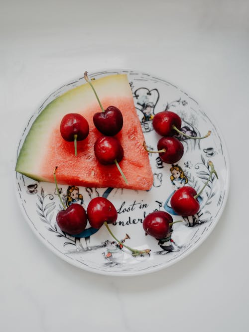 Cherries and a Watermelon Slice on a Plate