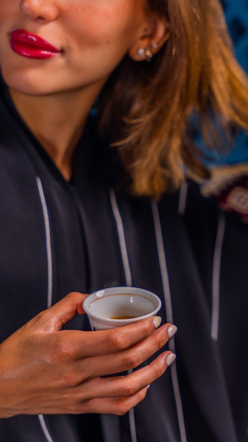 Woman with Glass of Tea