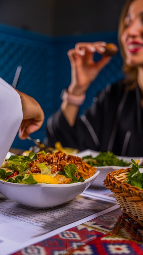 Free People Eating Salad in Restaurant Stock Photo