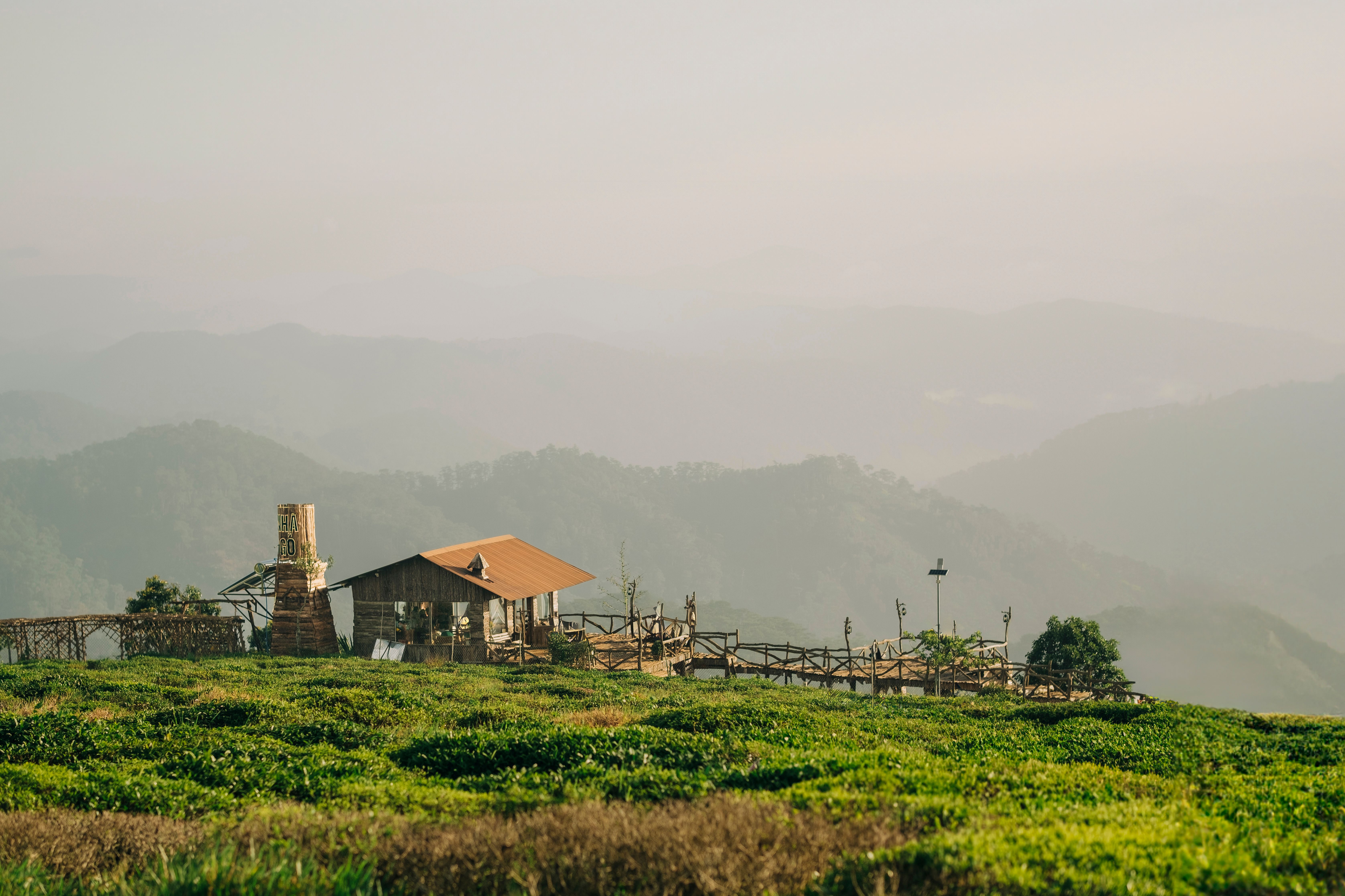 A misty valley resort terrace at sunrise