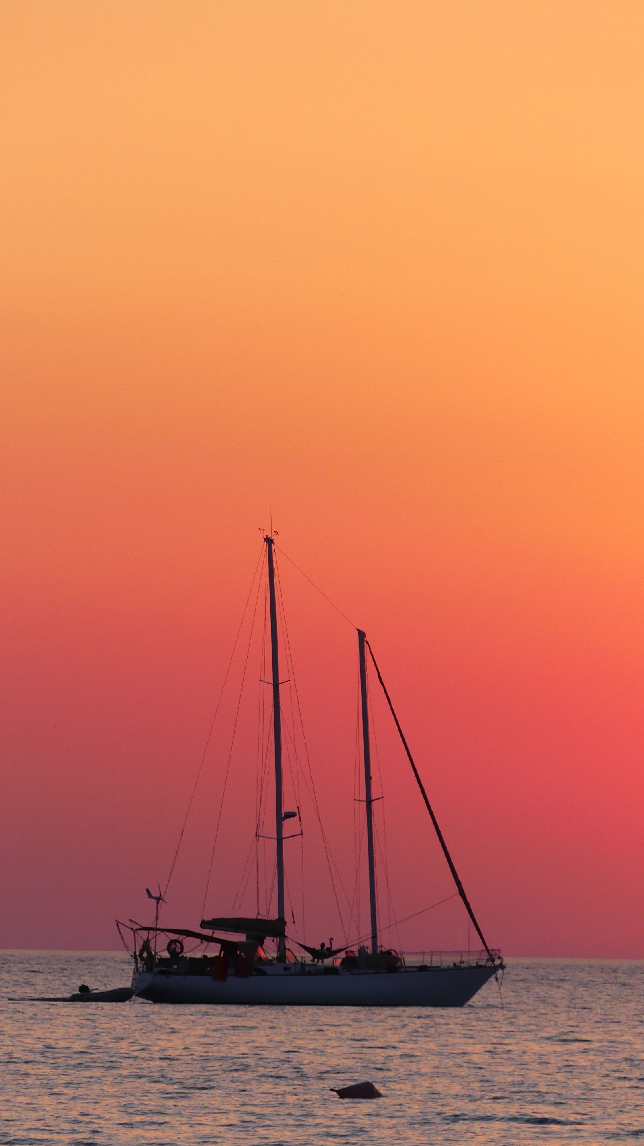 Sailboat on Body of Water during Sunset · Free Stock Photo