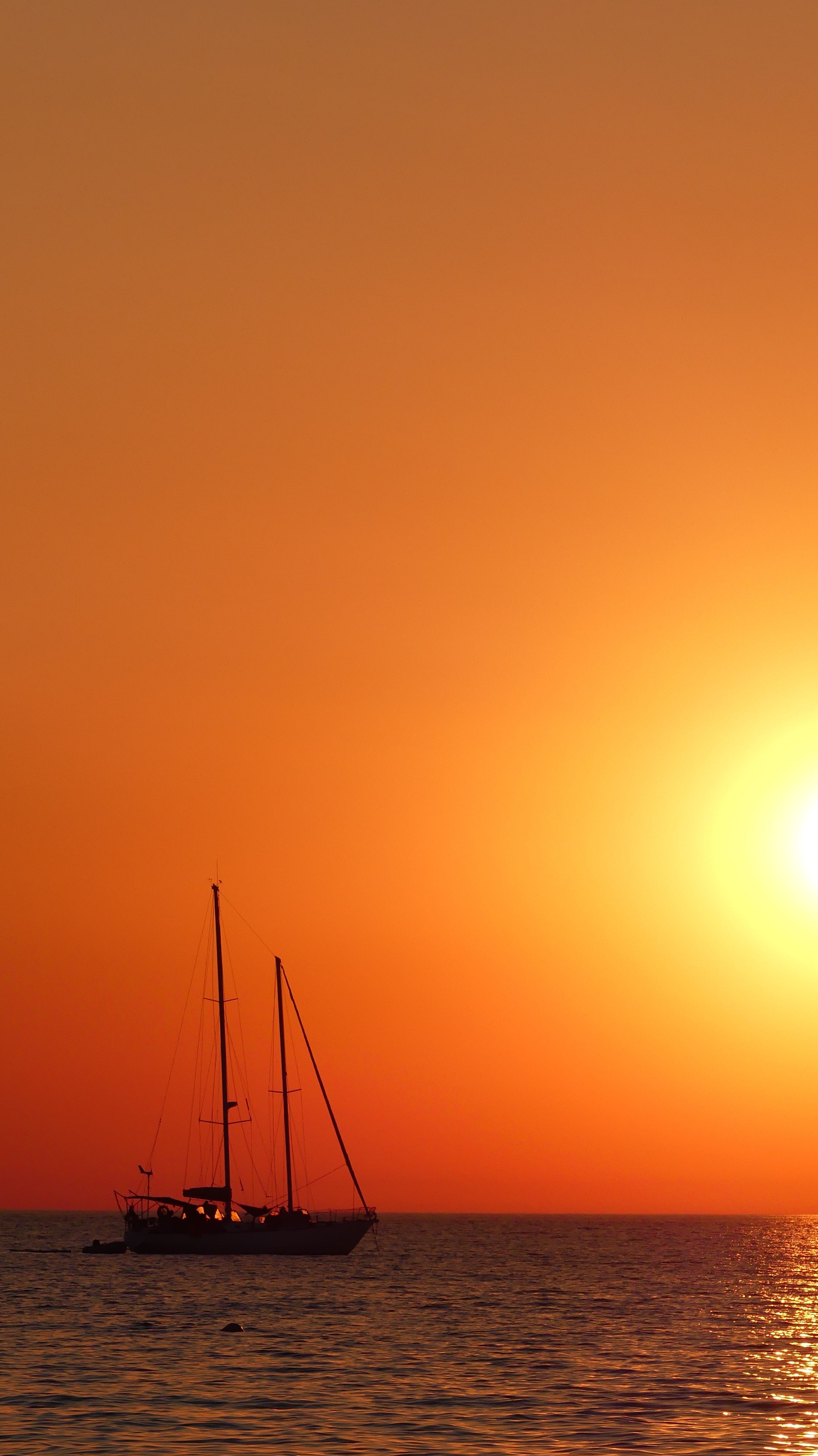 Sailboat on Body of Water during Sunset · Free Stock Photo