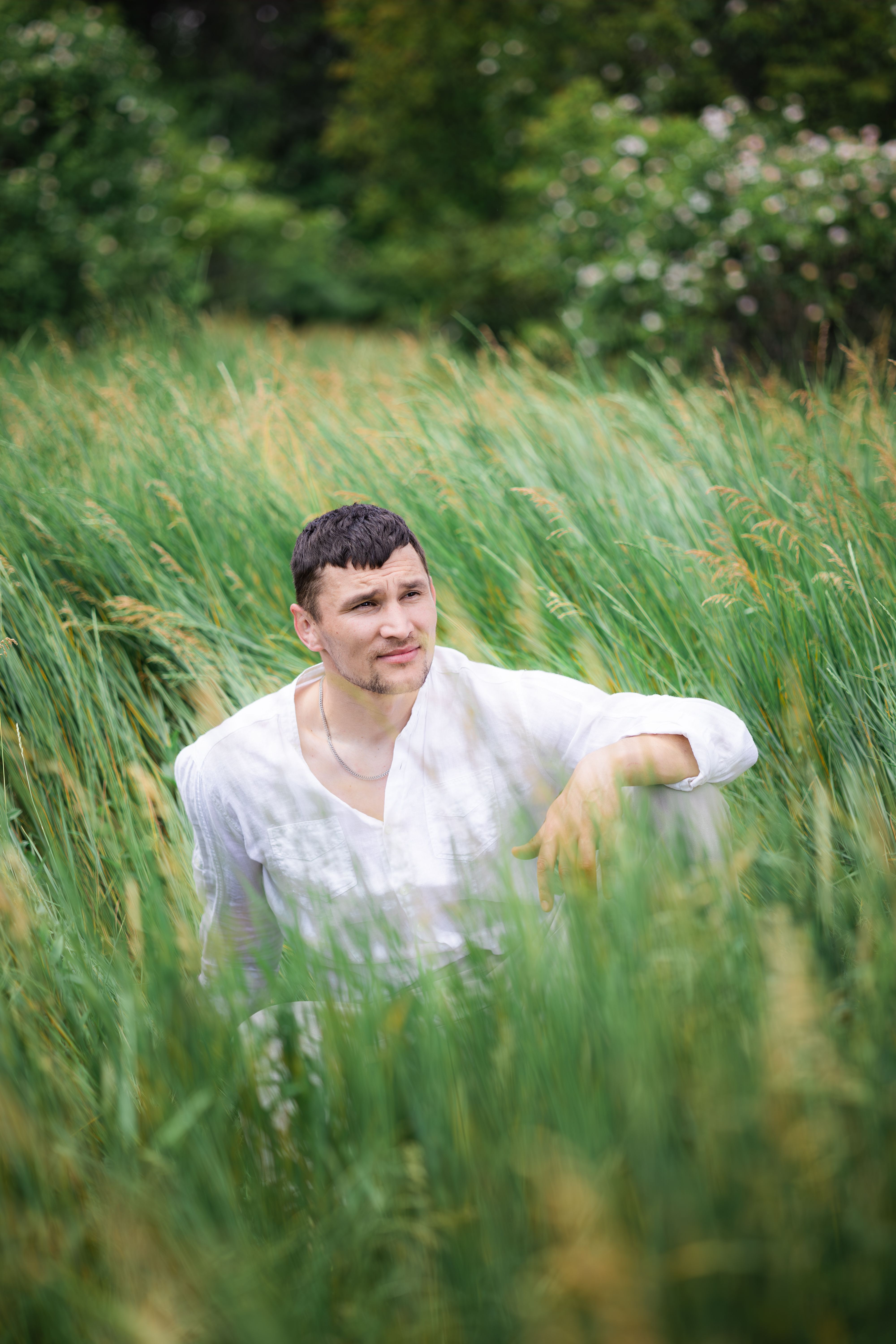 a handsome man resting on the grass · Free Stock Photo