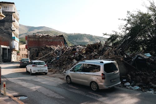 Cars near Destroyed Building in Town in Turkey after Earthquake