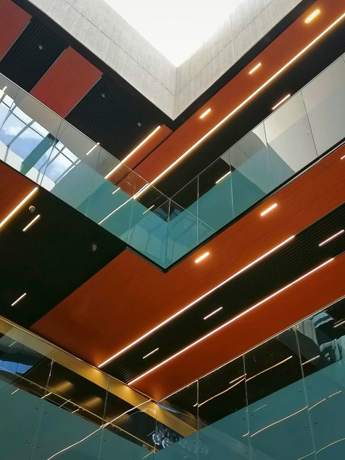 Modern interior architecture featuring geometric shapes and vibrant colors in a Mexico City building.