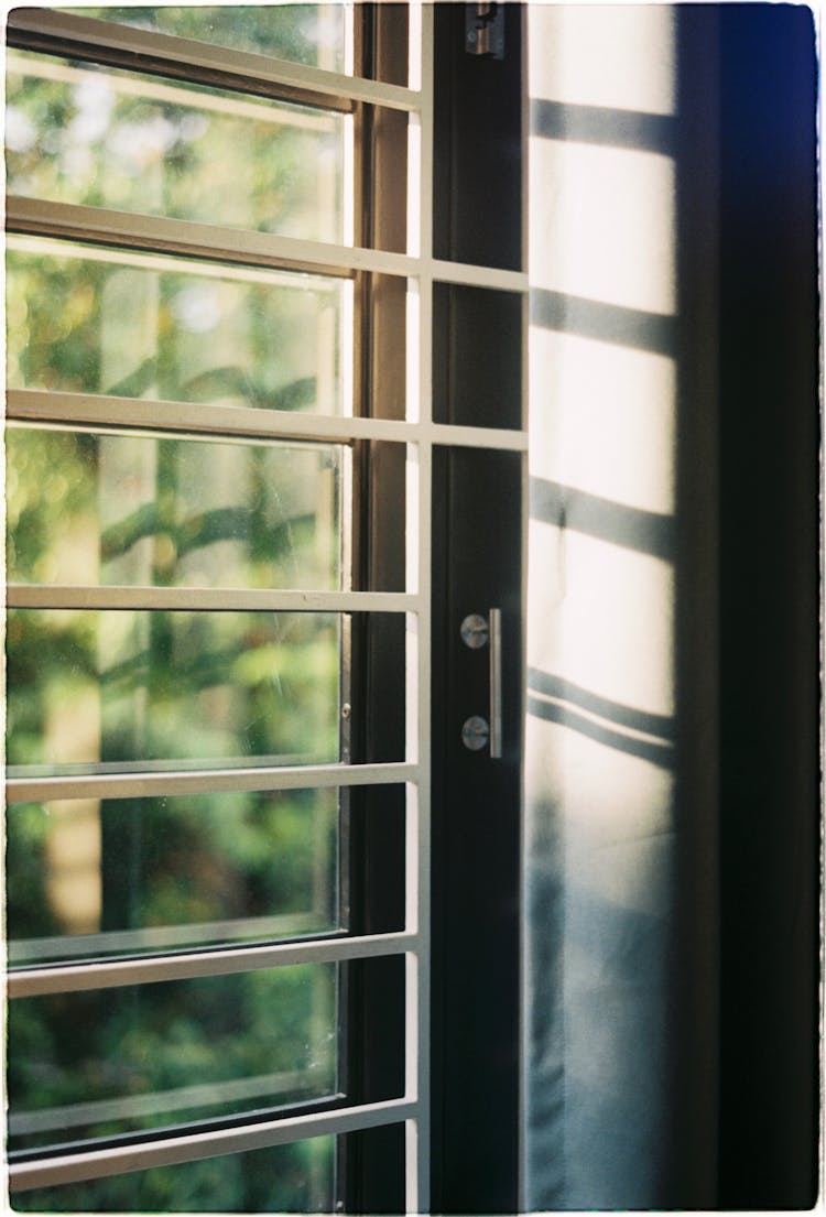 Sun Shining Through The Window With Shutters 