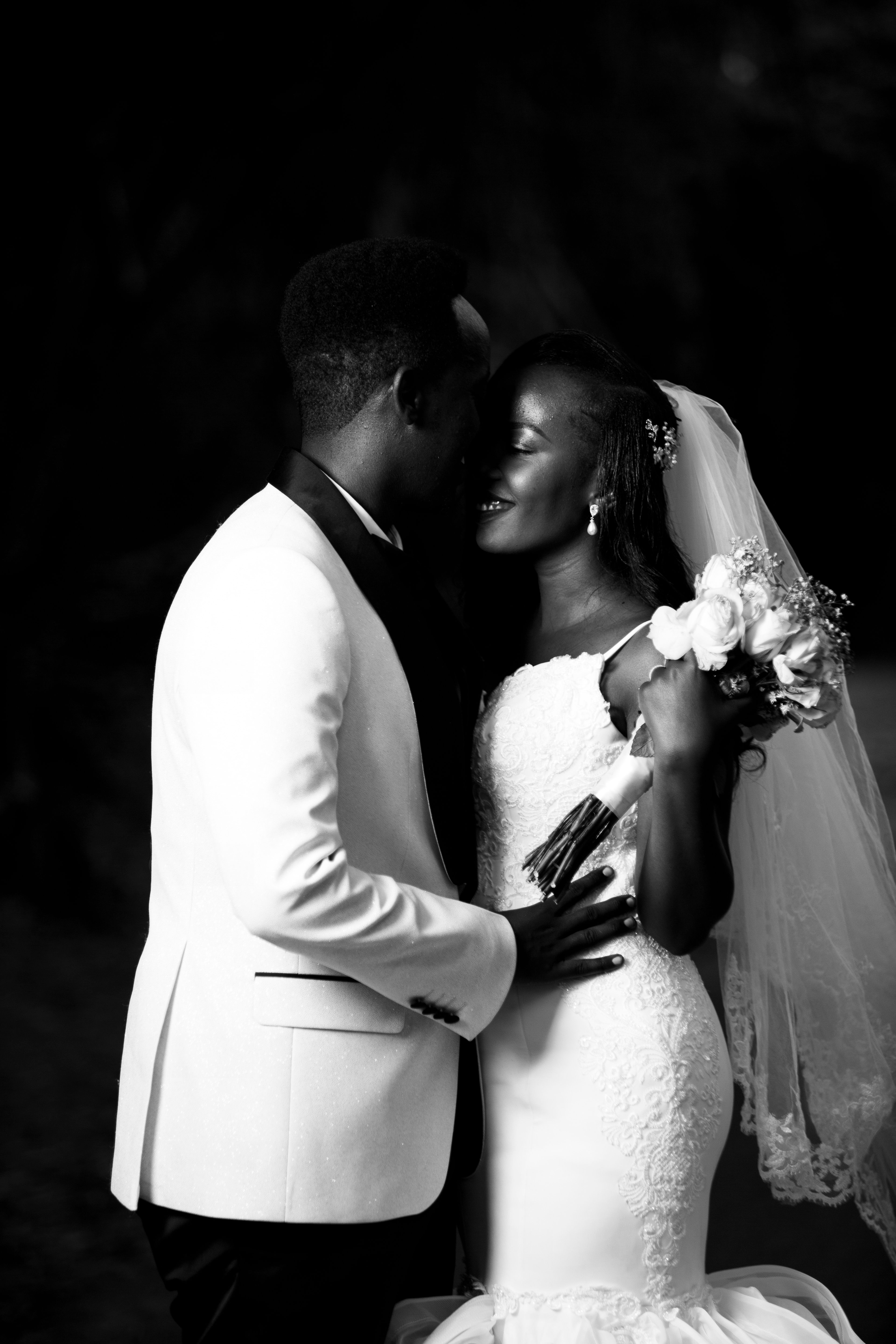 Black and White Photo of Newlywed Couple Kissing · Free Stock Photo