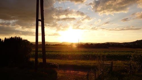 Green Field Landscape Photo during Sunrise