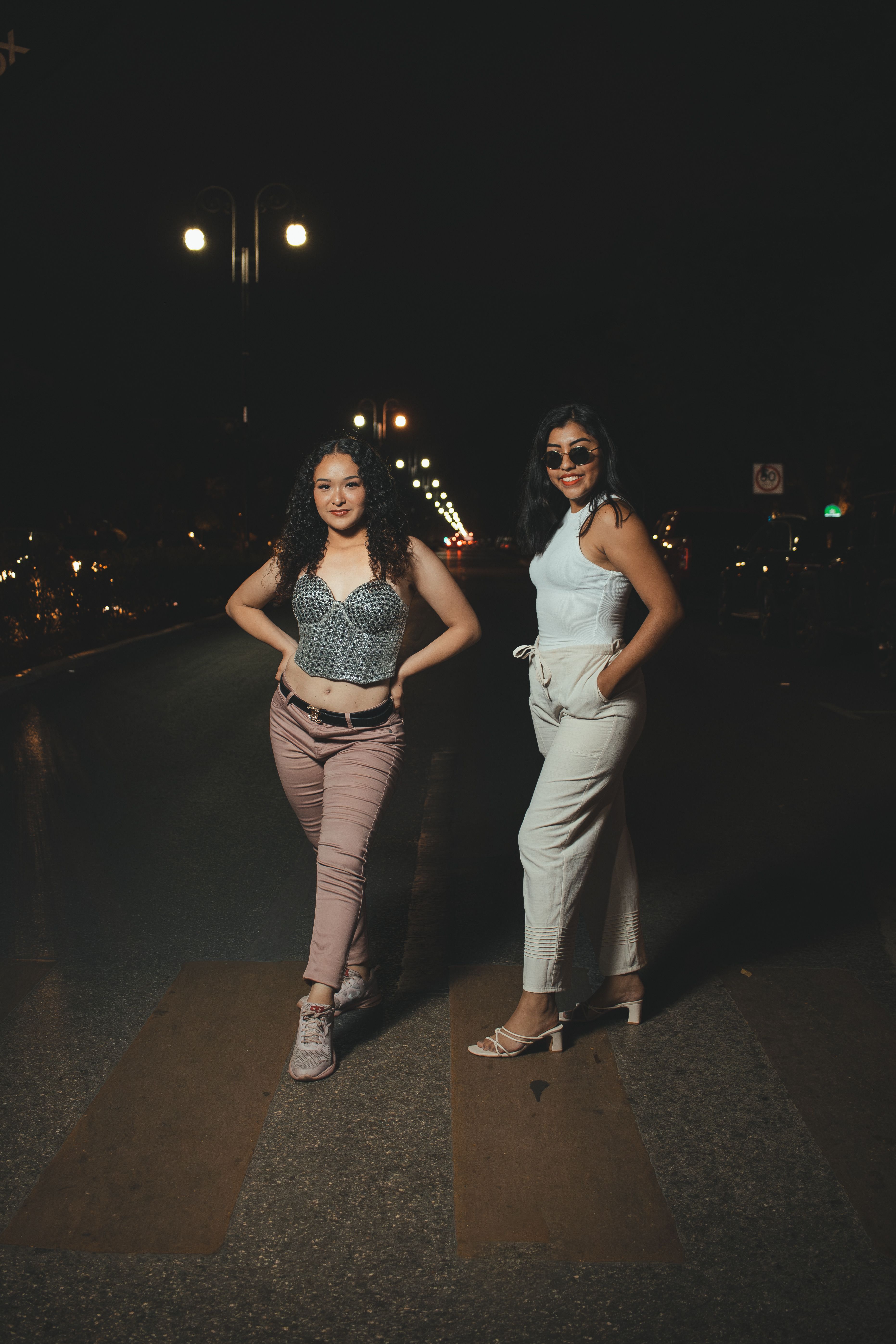 Two Women Standing Outdoors at Night · Free Stock Photo
