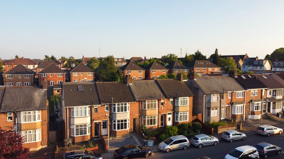 Aerial view of a UK residential neighbourhood illustrating typical family-home estates exposed to the residence nil-rate band taper
