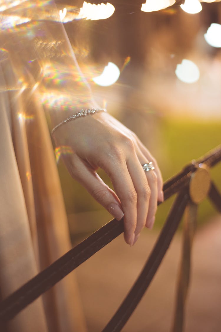 Close Up Of Woman Hand Touching Bar