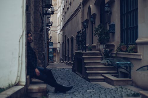 Woman in Narrow Old Town Street