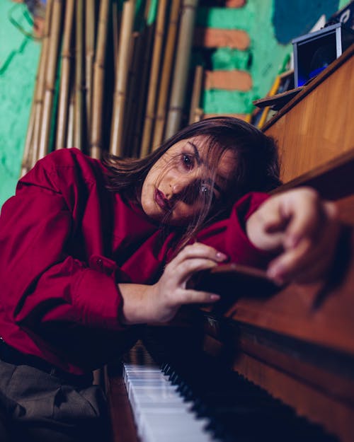 Young Woman with Her Head Lying on a Piano 