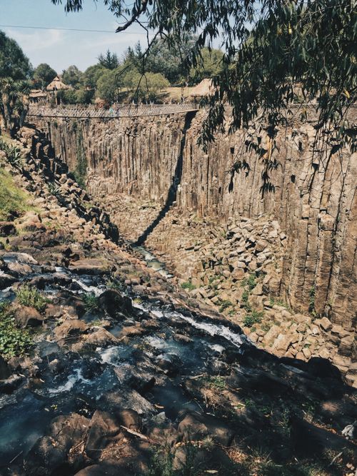 Free Explore the natural beauty of basalt prisms in Huasca de Ocampo, Mexico, with flowing streams and rugged cliffs. Stock Photo