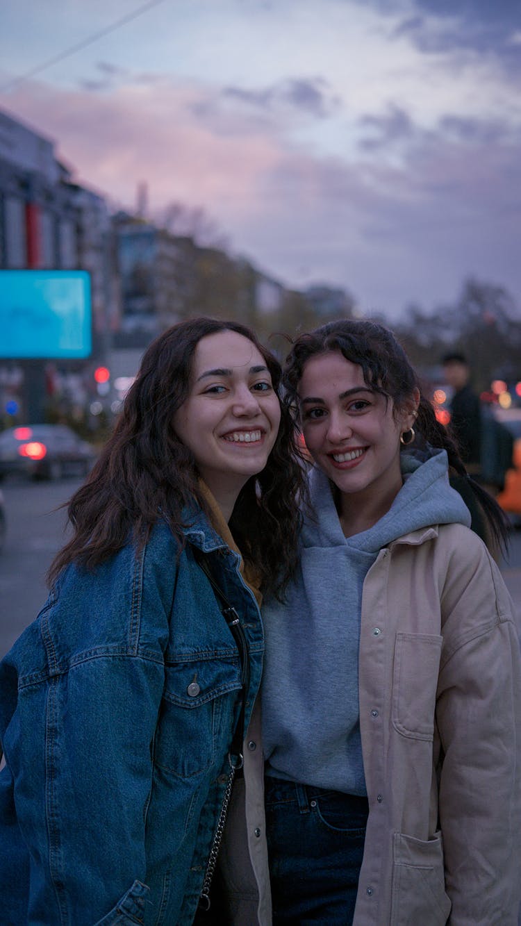 Happy Teenage Girls Posing On Street