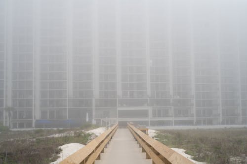 Facade of a Large Block of Flats in Fog 
