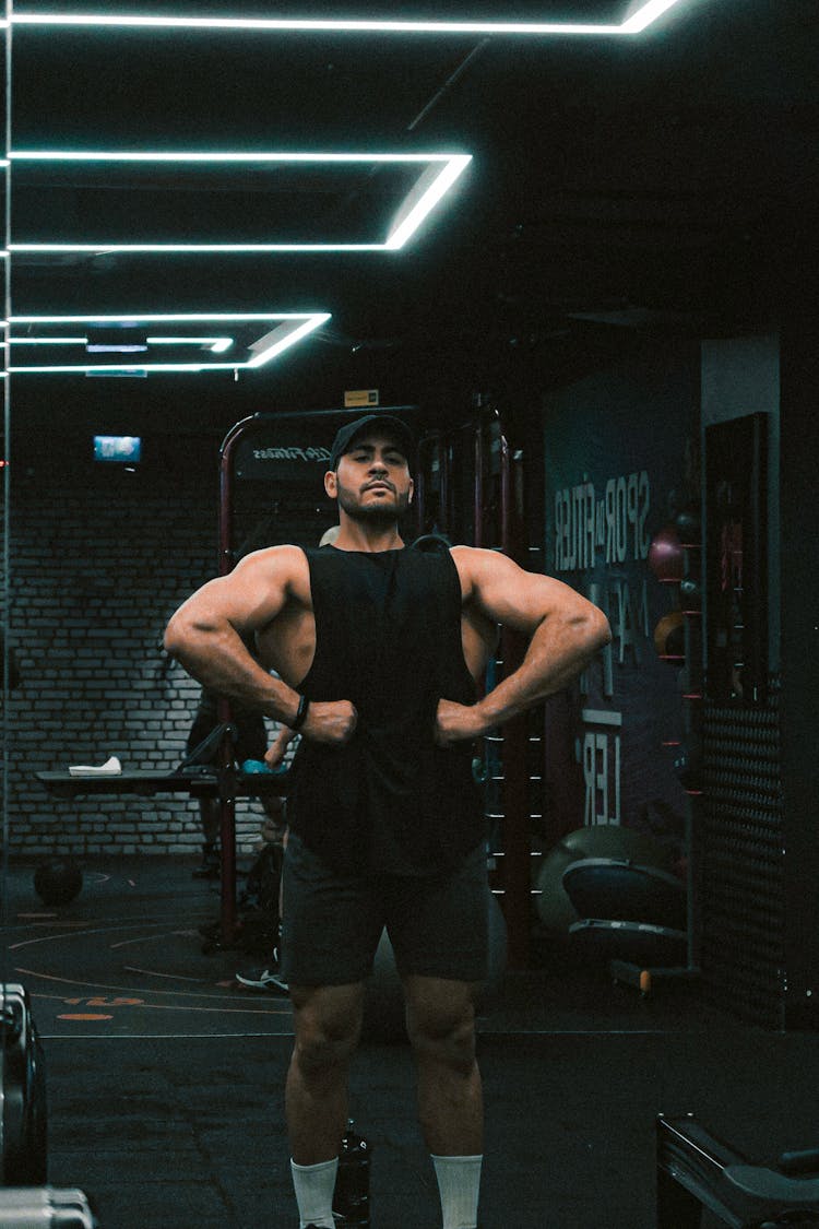 Man Posing At Gym