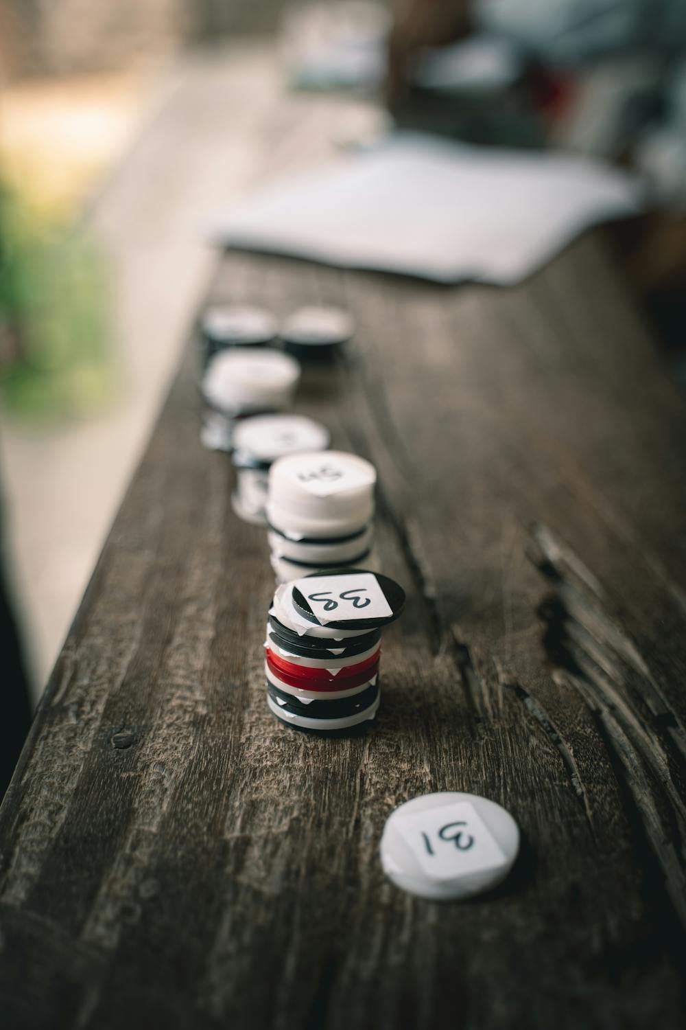Close-up of a Stack of Numbered Tokens on a Wooden Surface · Free Stock ...